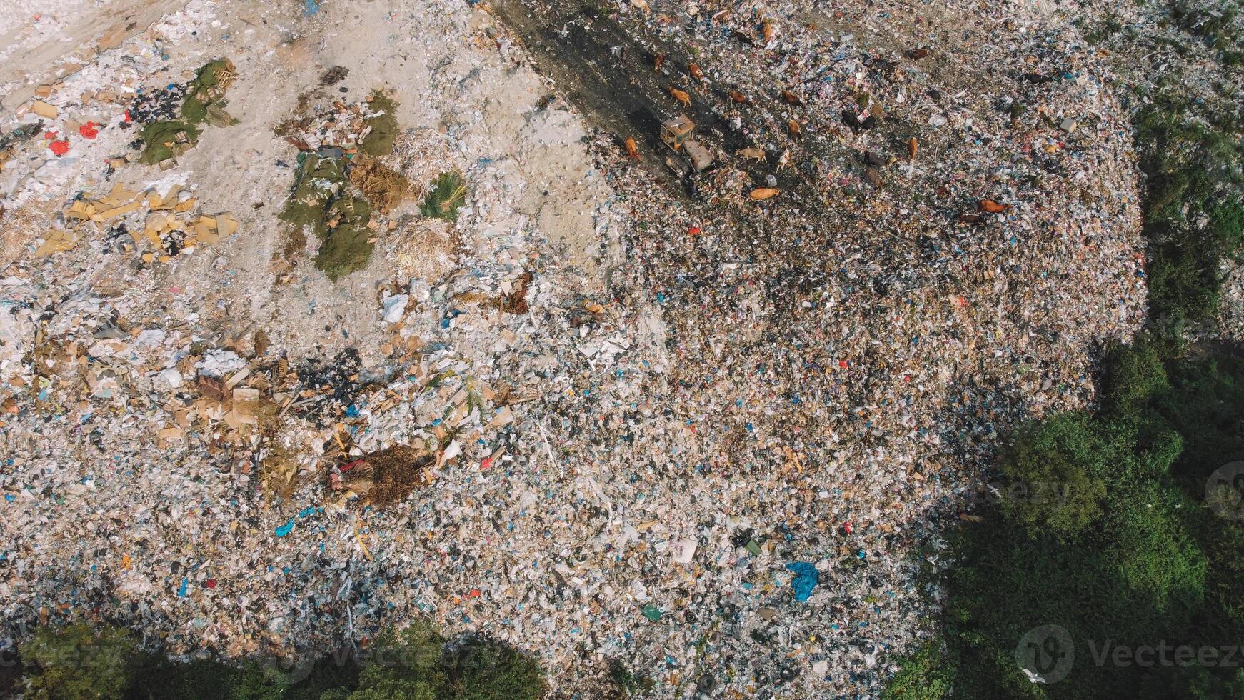 Garbage Vs Nature Stark Contrast. Mountains Of Trash Aerial. photo