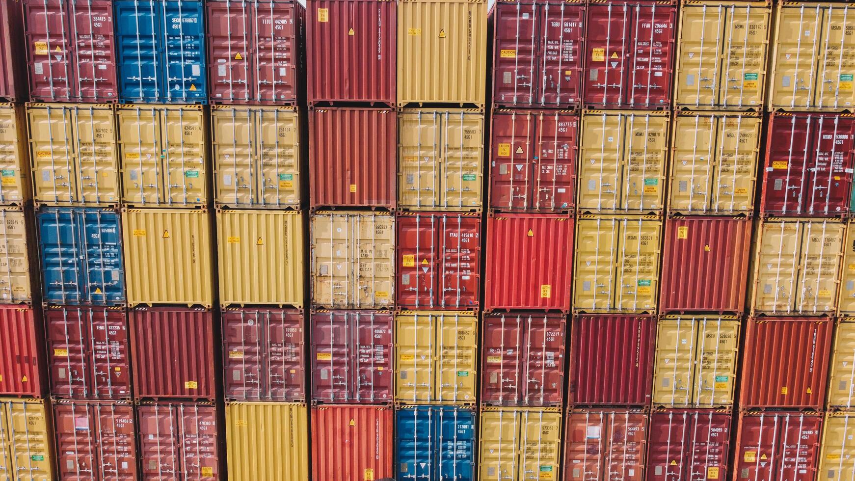 Shipping Containers In Warehouse Aerial. Aerial View Of Container Yard photo