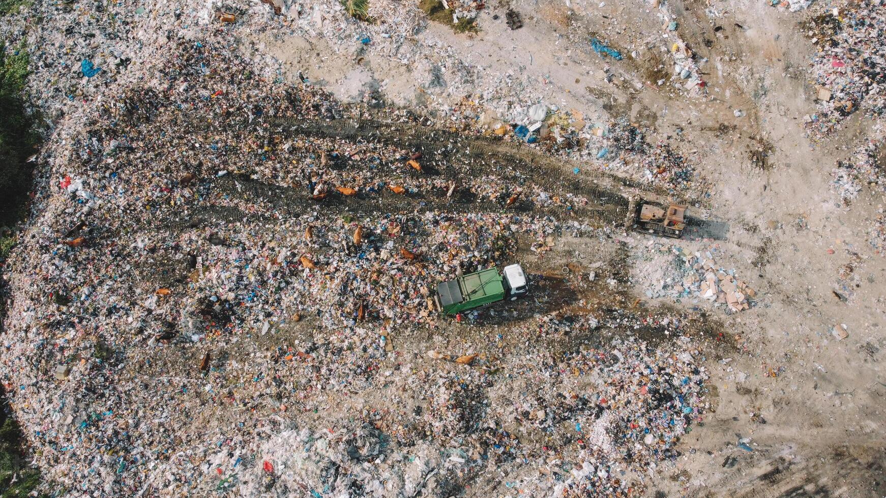 Garbage Vs Nature Stark Contrast. Mountains Of Trash Aerial. photo