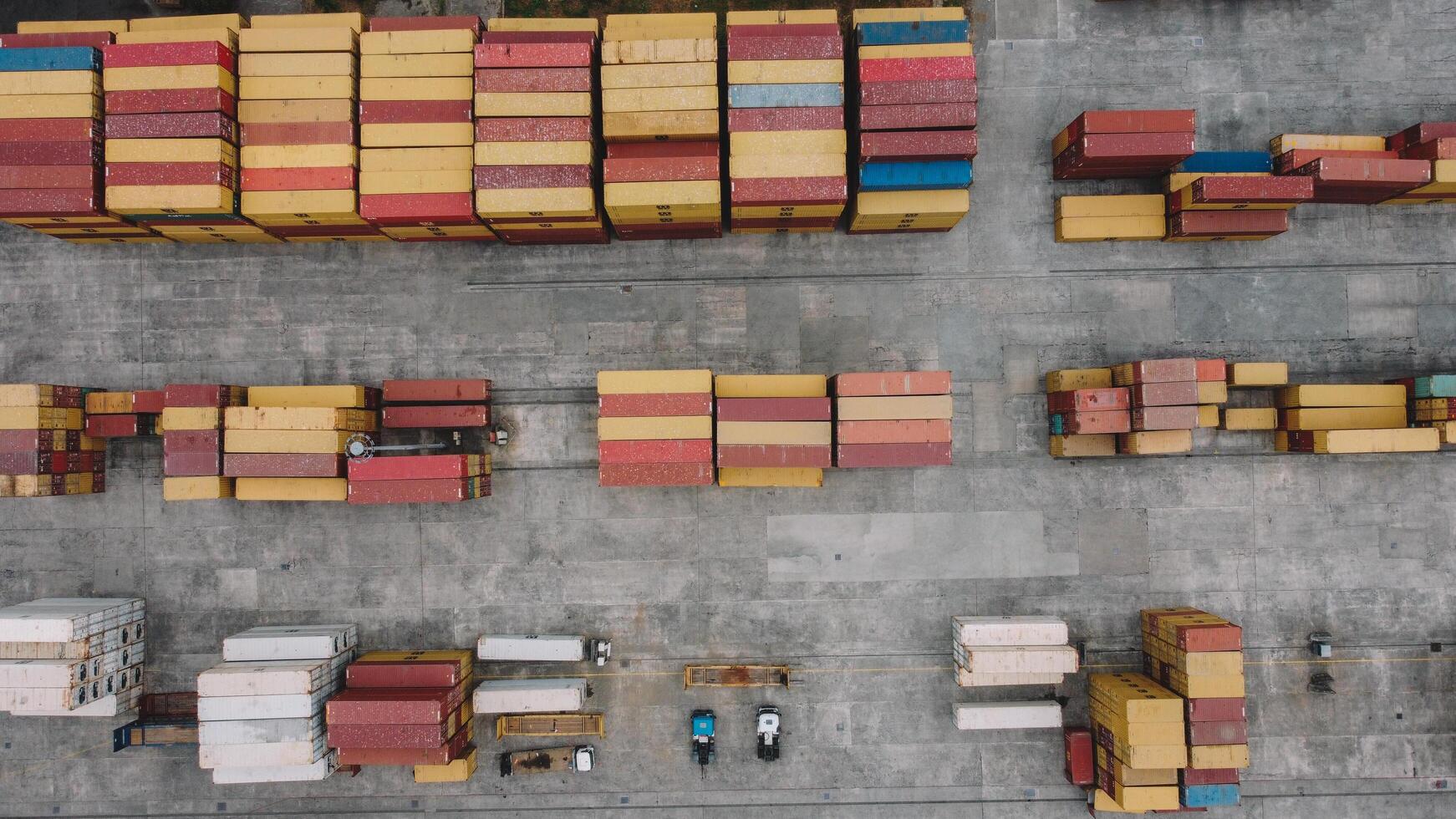 Shipping Containers In Warehouse Aerial. Aerial View Of Container Yard photo