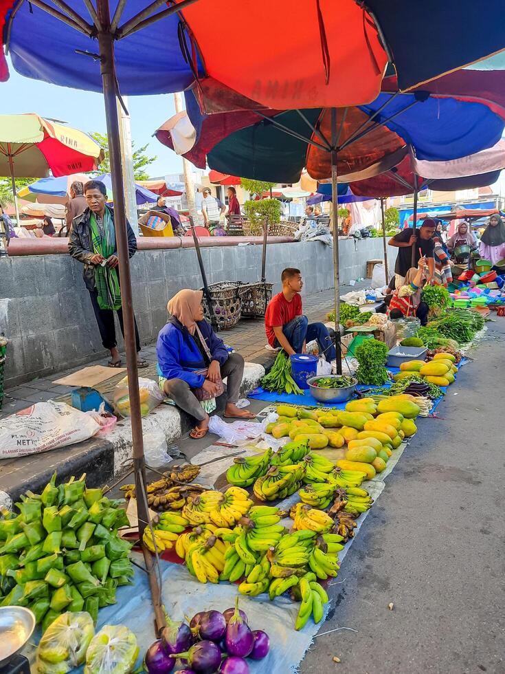 Pariaman, Indonesia - July 27, 2024. Traders sell along the roadside in the Pasar Rakyat area in Pariaman City. photo