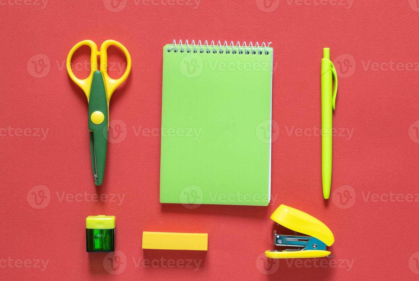 Back to school concept. School and office supplies on the office table. Orange background.Flat lay with copy space.Autumn photo
