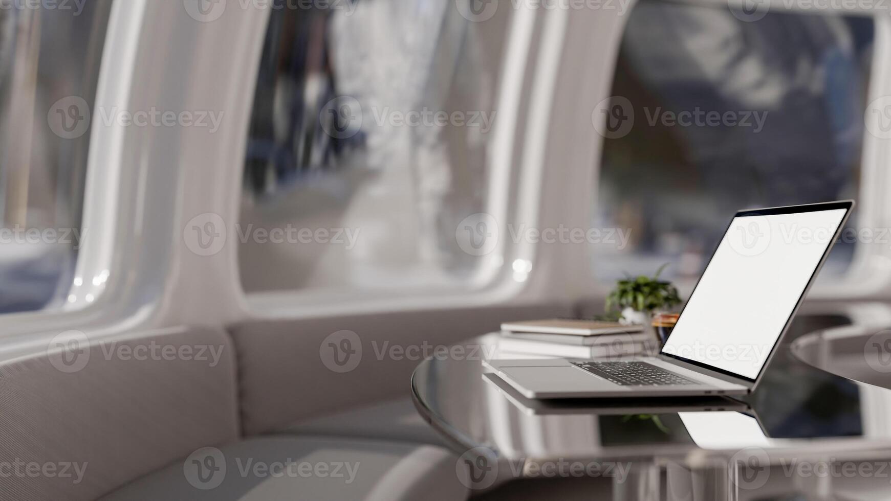 A laptop mockup on a modern metallic chrome table in a cafe with a futuristic spaceship theme. photo