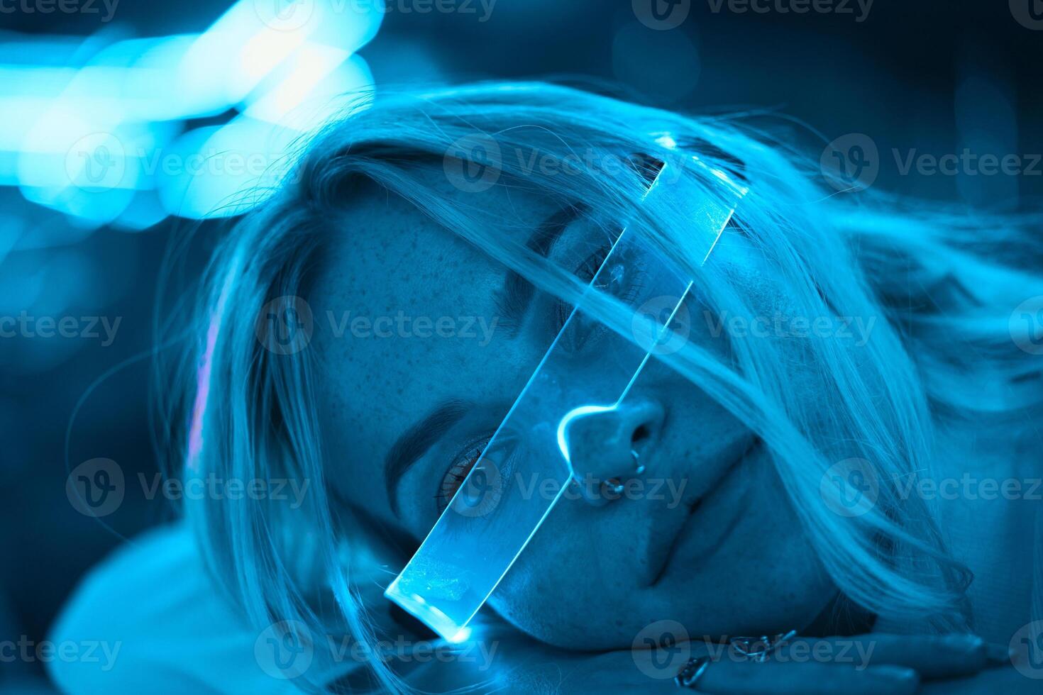 Portrait of a blonde in neon glasses. photo
