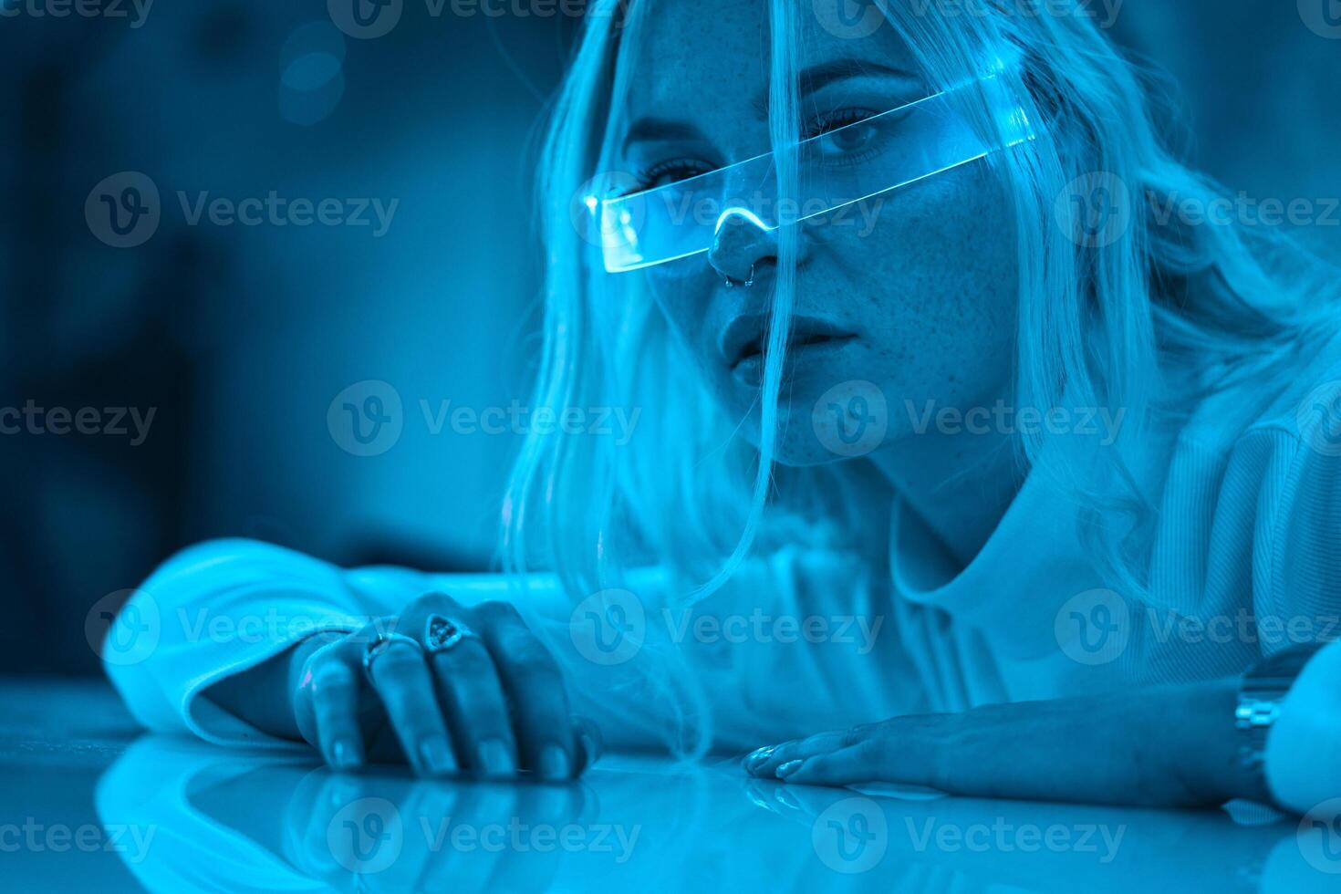 Portrait of a blonde in neon glasses. photo