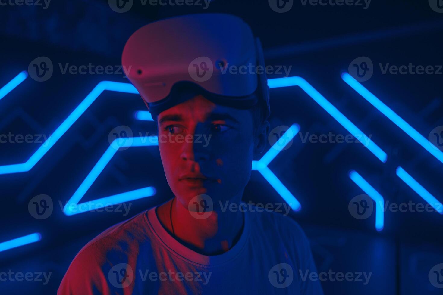 Player plays games in vr glasses. Portrait of a man ready to start the game. photo