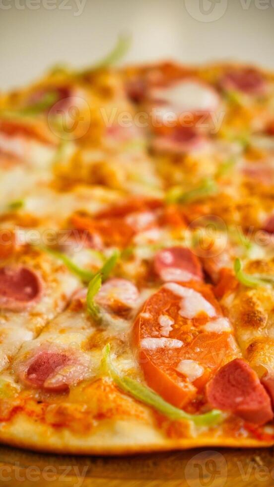 Close Up Of A Pizza With Tomatoes And Pepperoni photo