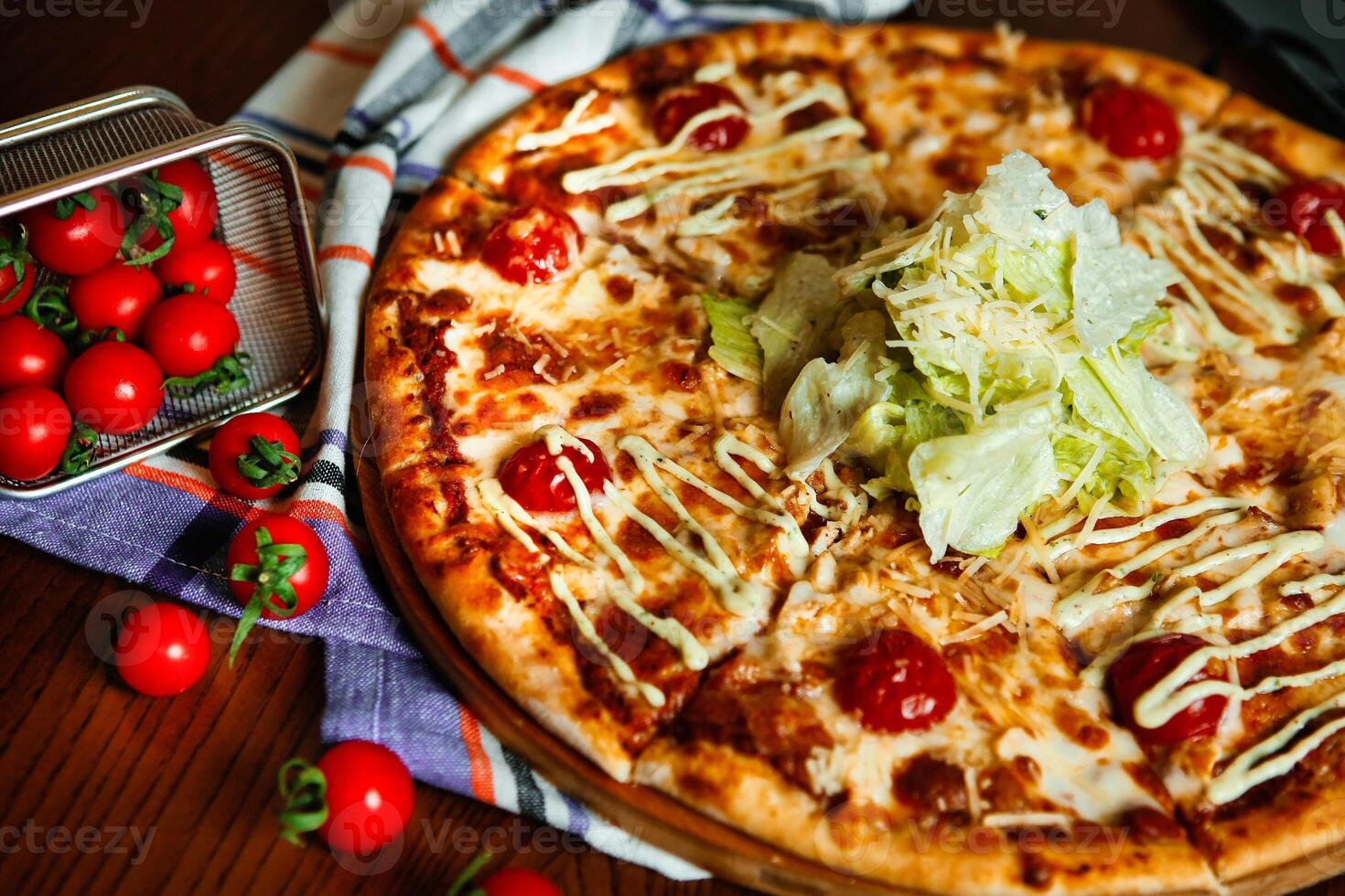 Pizza With Salad and Tomatoes photo