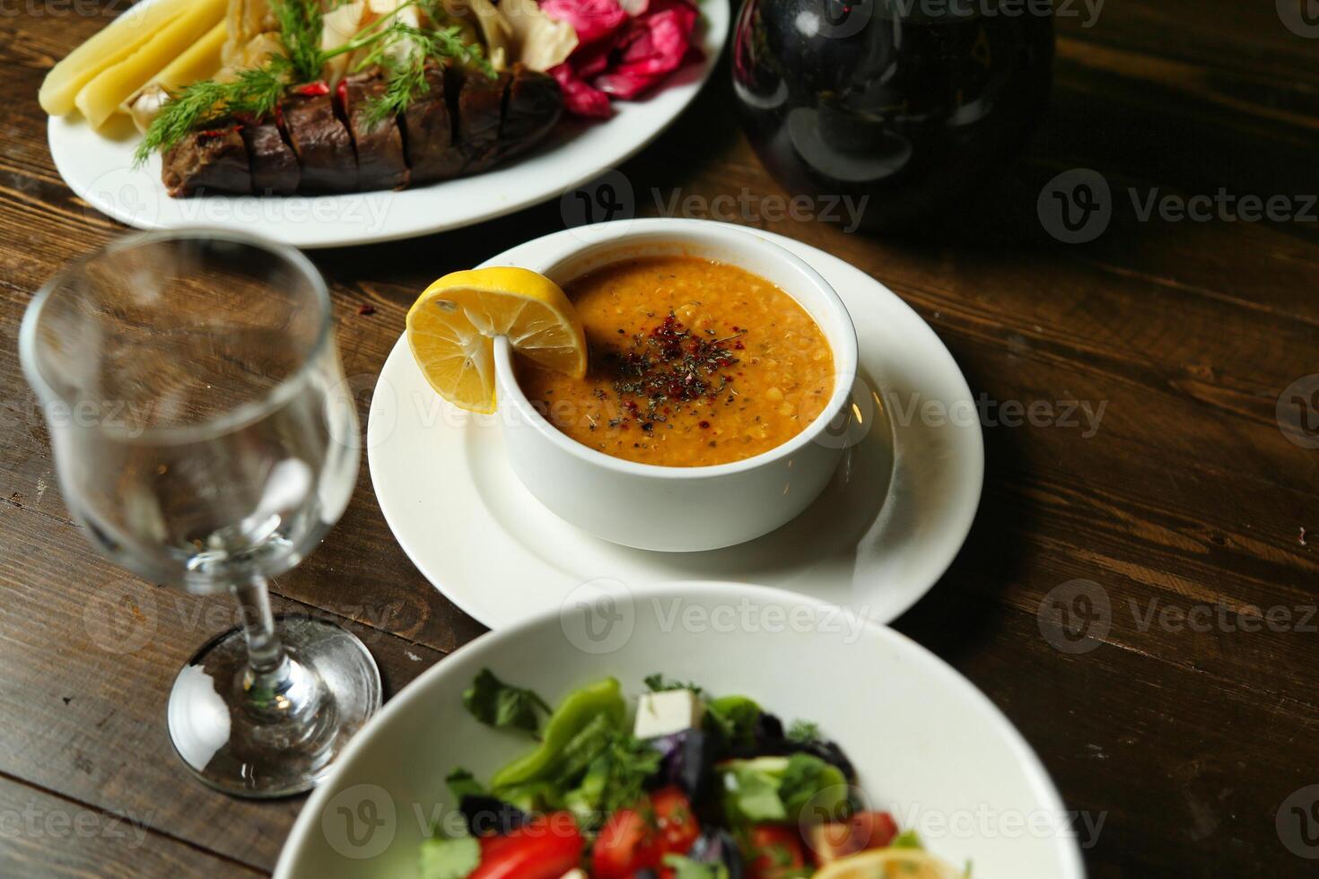 Lentil Soup and Salad on a Wooden Table photo