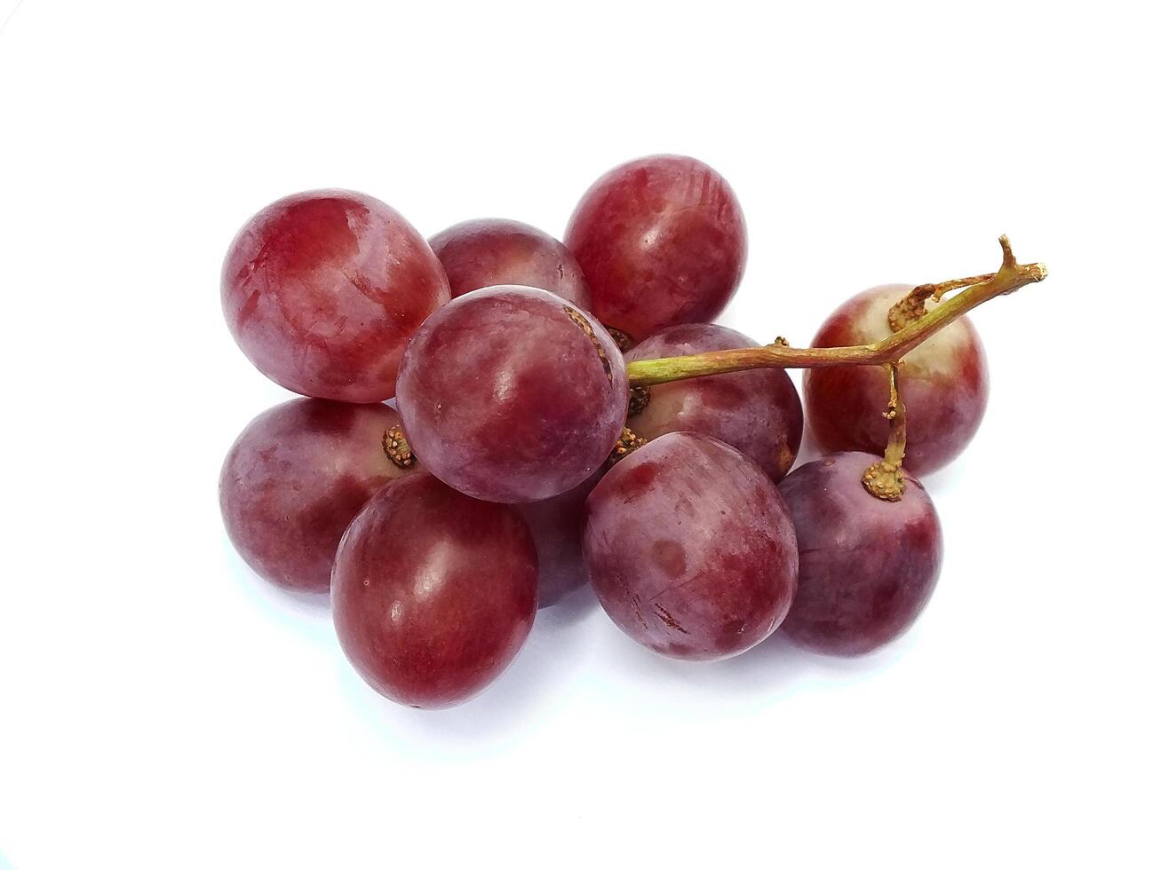 Ripe red grape fruit. bunch of red grape isolated on white. Fresh healthy natural food photo