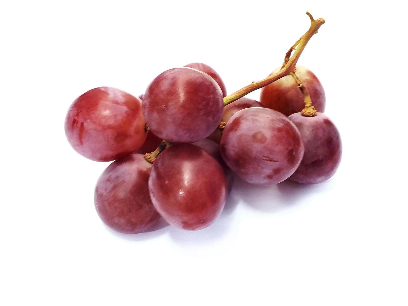 Ripe red grape fruit. bunch of red grape isolated on white. Fresh healthy natural food photo