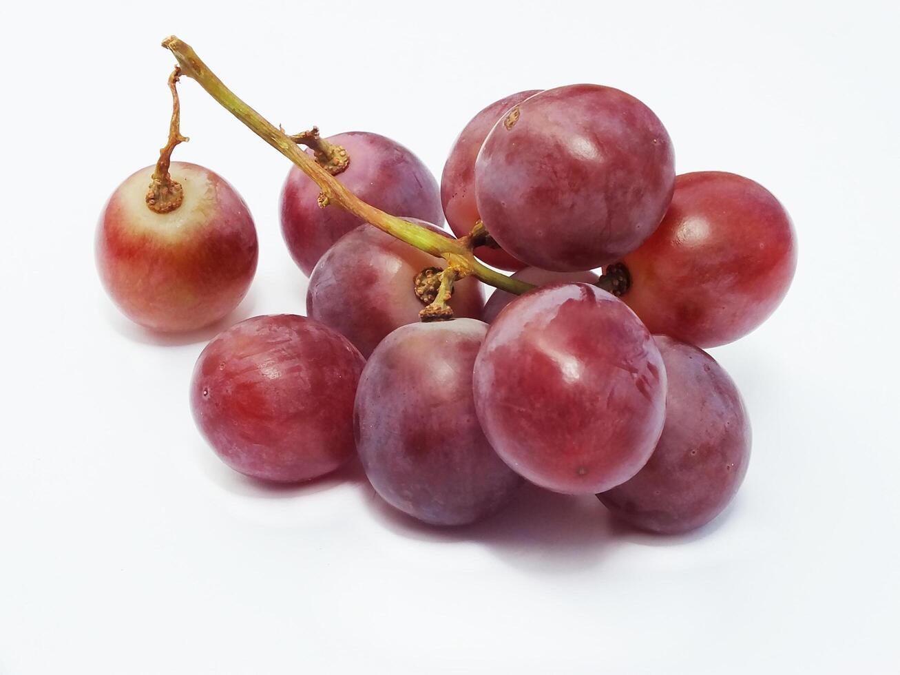 Ripe red grape fruit. bunch of red grape isolated on white. Fresh healthy natural food photo