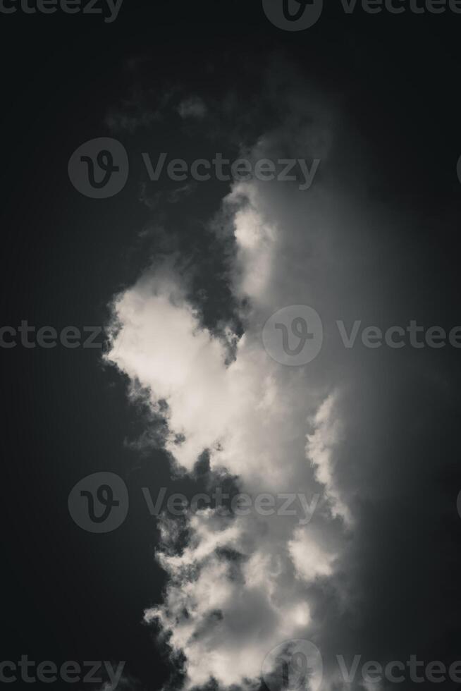 Closeup view of clouds in the sky, with sunlight creating contrasts that give depth and texture photo