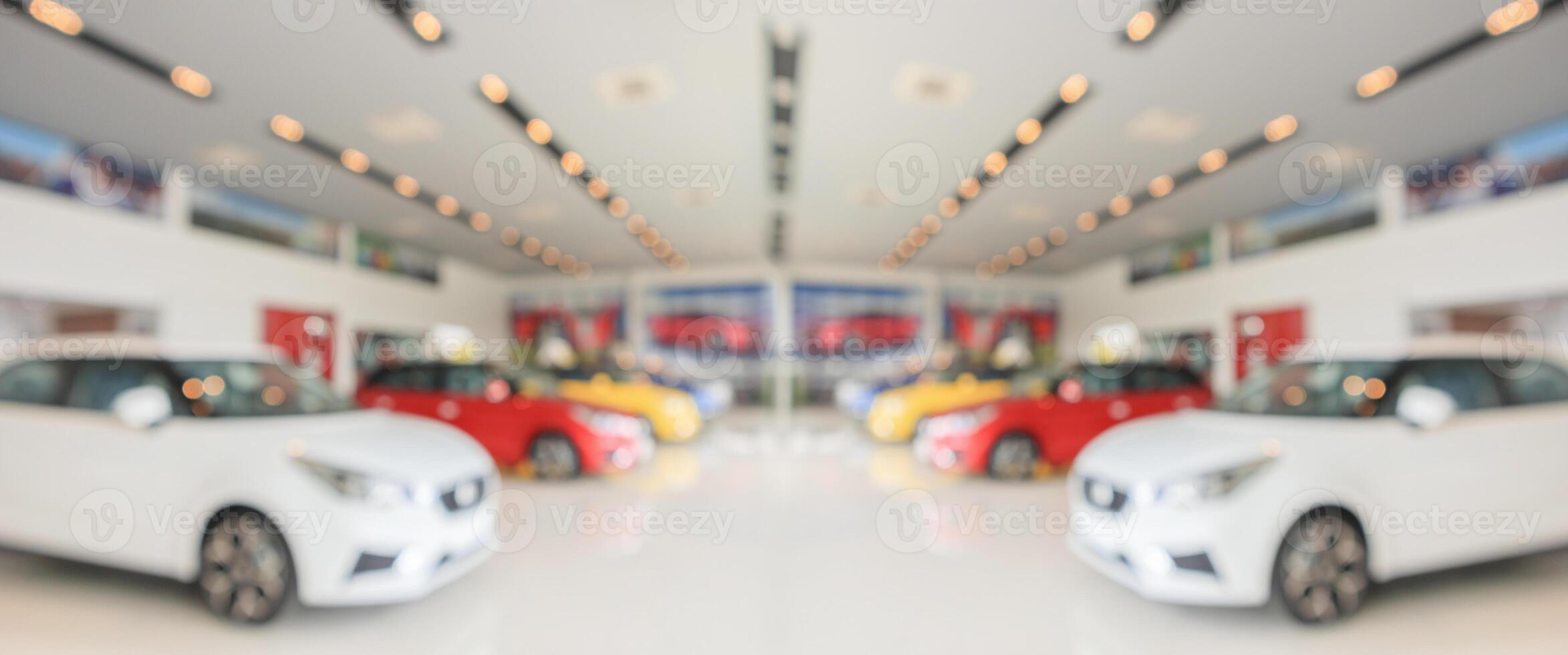 new cars in showroom interior blurred abstract background photo