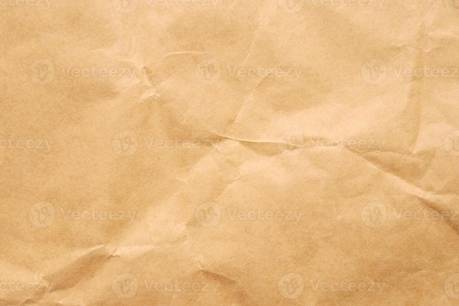 Abstract crumpled and creased recycle brown paper texture background photo