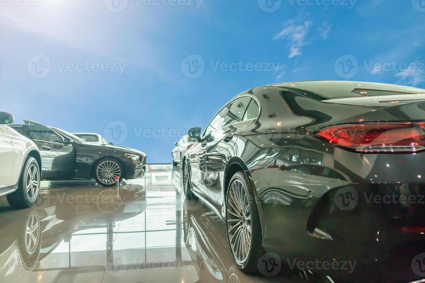 new car in the car dealership showroom with blue sky photo