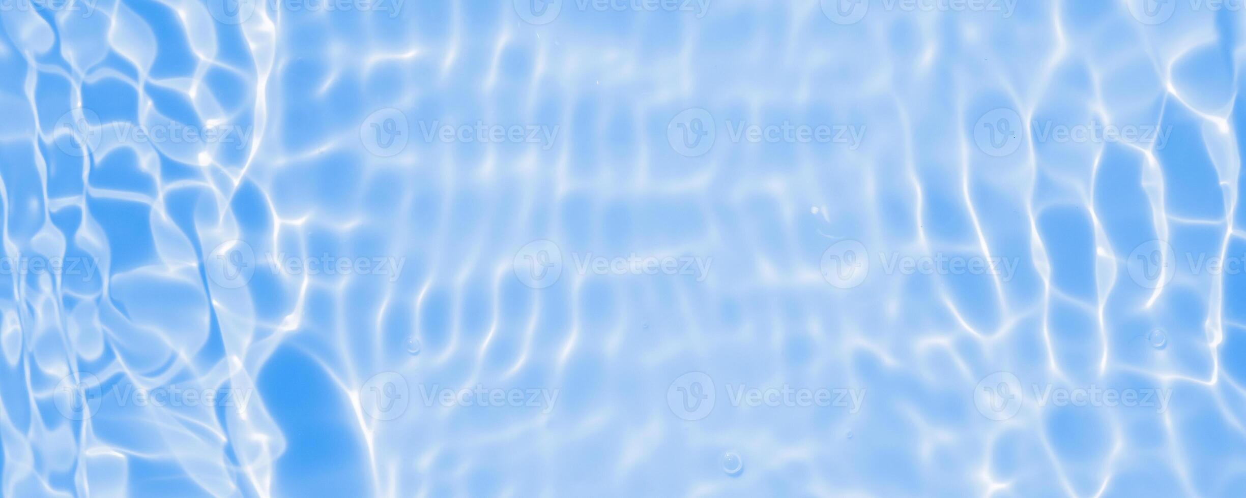 Abstract transparent water shadow surface texture natural ripple on blue background photo