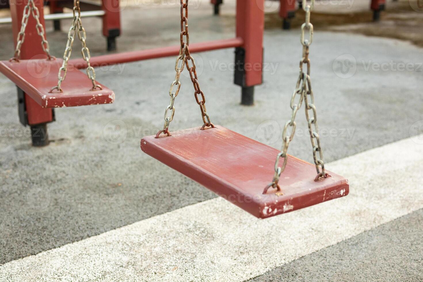 Empty chain swing in the playground photo