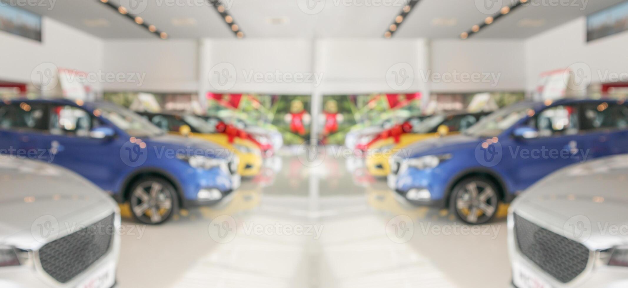 new cars in showroom interior blurred abstract background photo