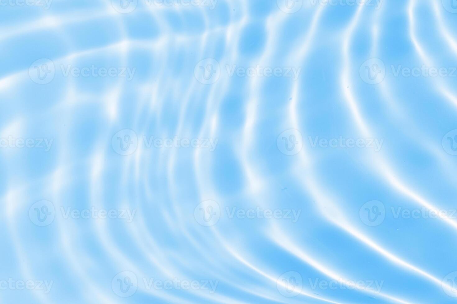 Abstract transparent water shadow surface texture natural ripple on blue background photo