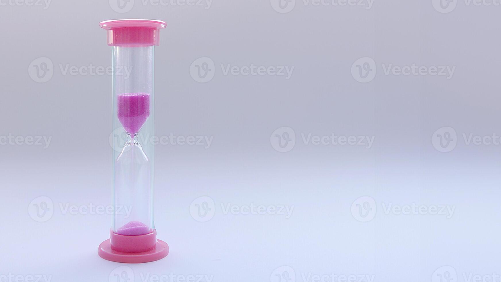 Hourglass on a white background with space for text. The concept of patience, change and the preciousness of moments, the passage of time. Productivity and mindfulness photo