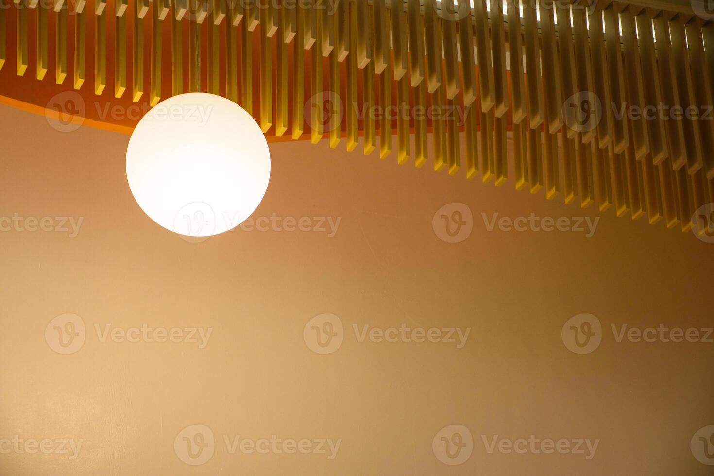 Lamps interior with a brown wall in the modern house style, View of a modern beautiful ceiling light. The minimalist interior is decorated with circular light bulbs in warm tones 2024. photo