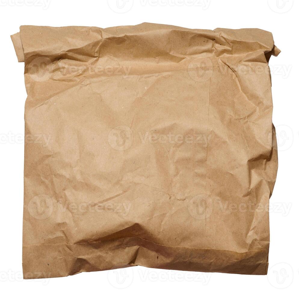 Brown kraft paper bag for packaging products in stores on an isolated background photo