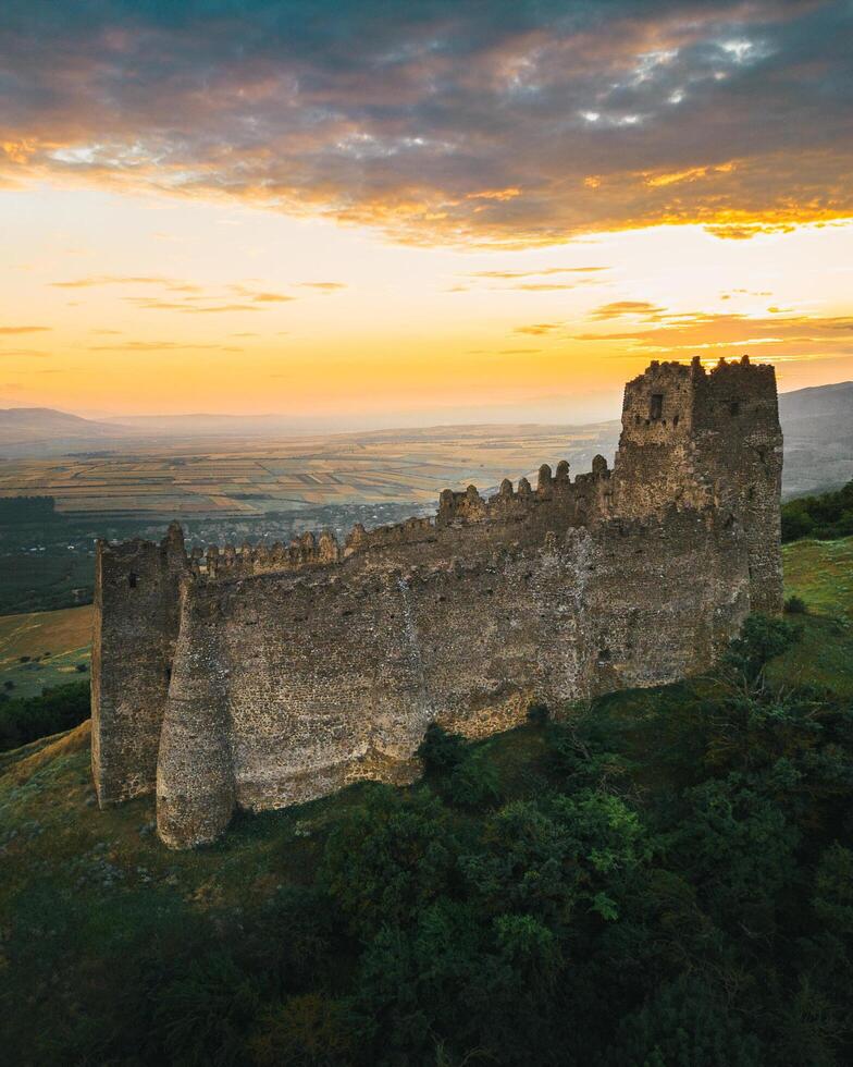 Aerial circular view The Skhvilo fortress or Skhvilo castle. Medieval fortress in region of Shida Kartli, in Kaspi District, Georgia. 14th century. Served as residence of the duke family Amilakhor photo