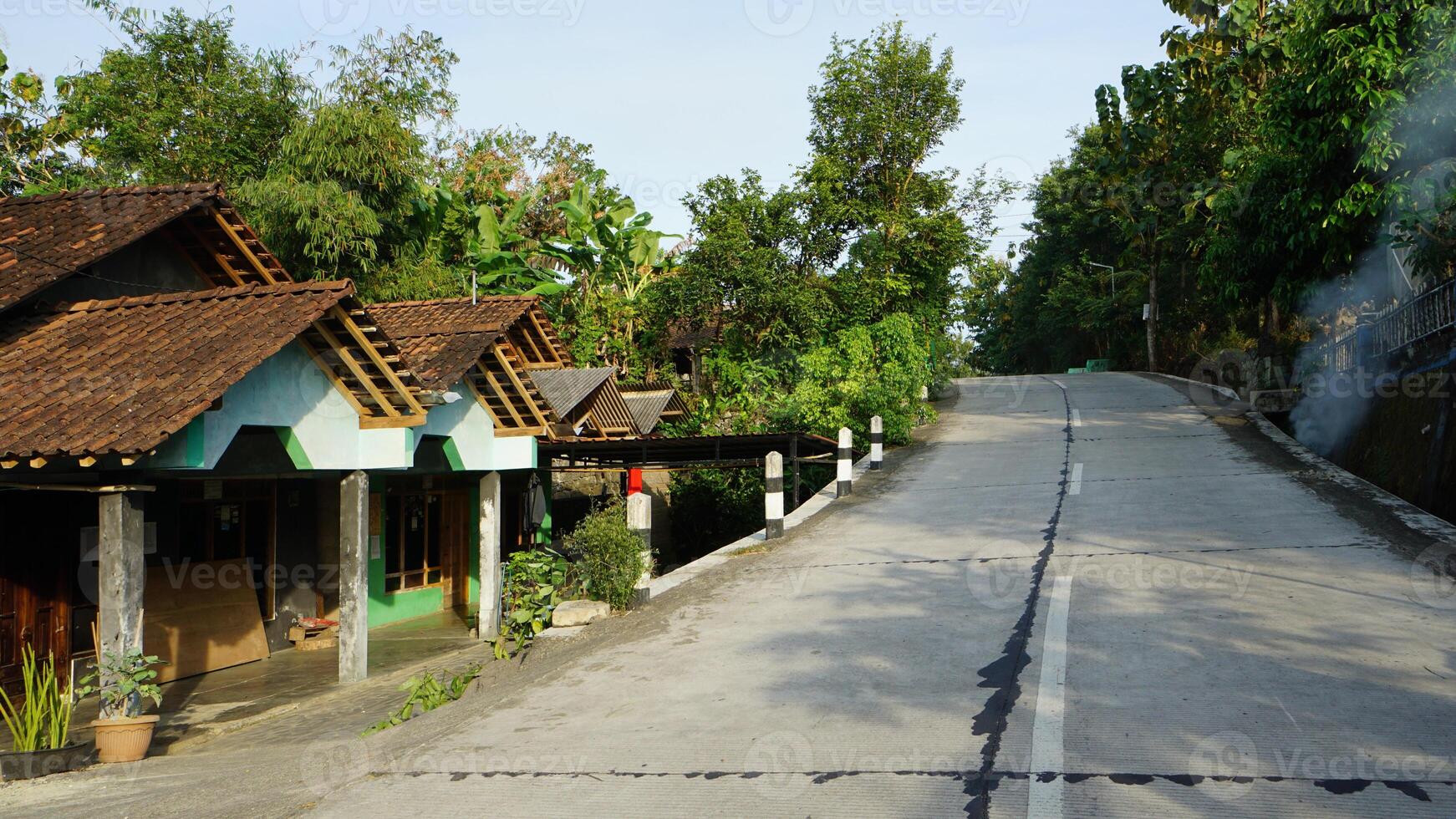 a road with a house on it and a sign that says house photo