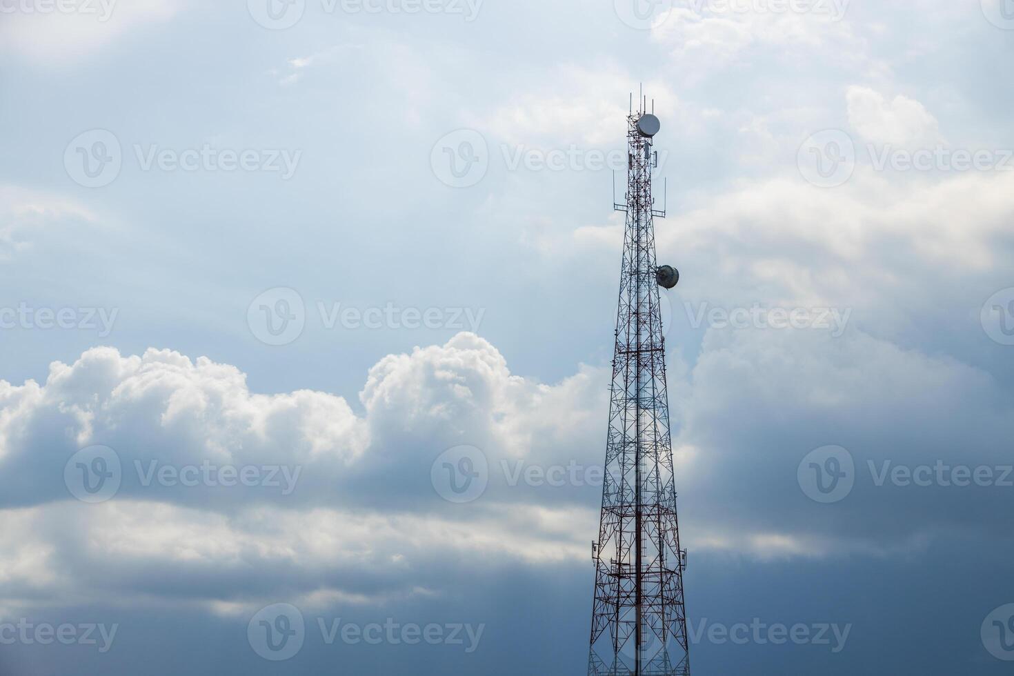5G Telecom signal tower. Telecommunication Tower on blue cloudy storm sky for background, Technology Mobile Network Concept. photo