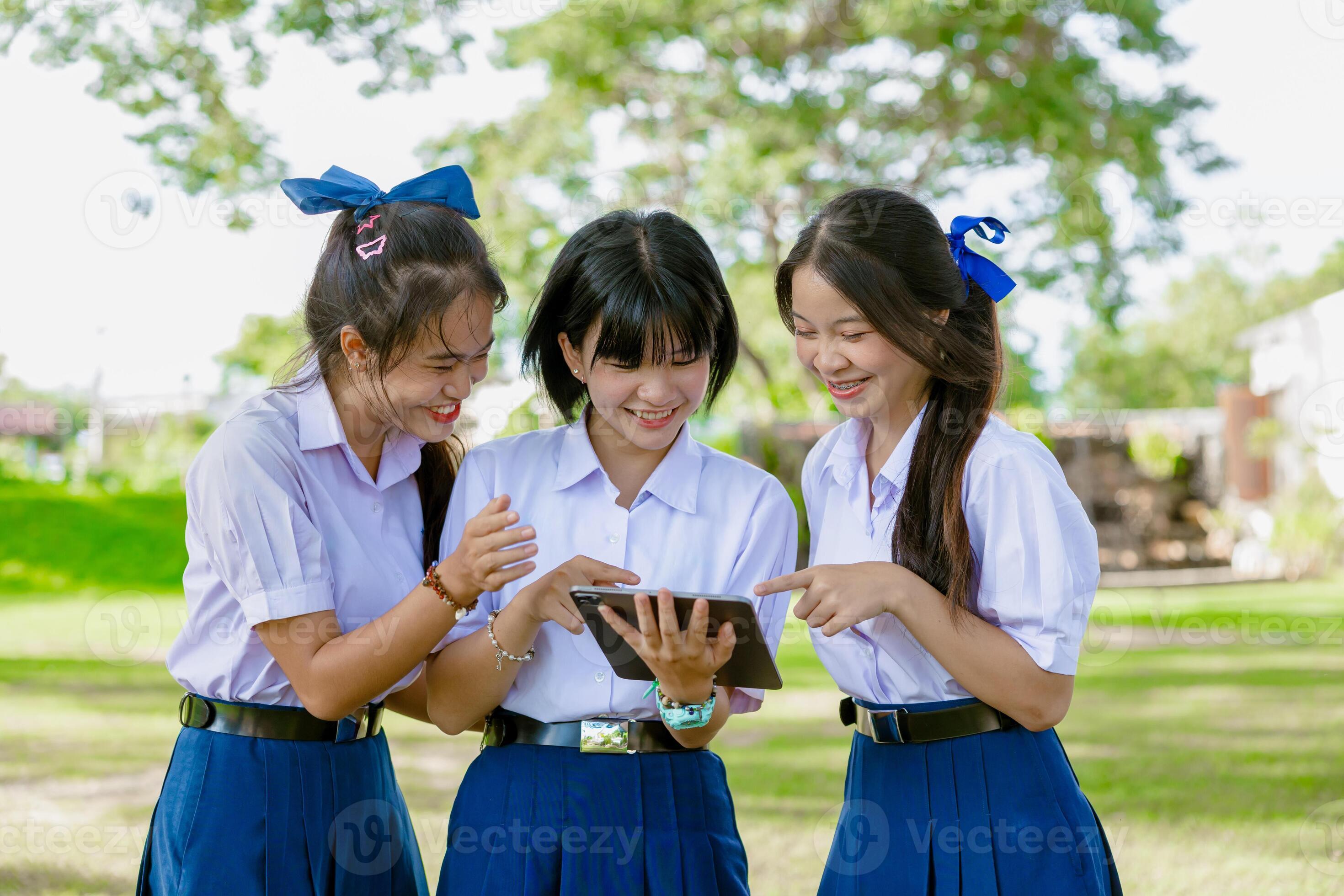 Asian school girls Group of Asian school girls teen friend in school uniform together look  tablet happy smiling 48785819 Stock Photo at Vecteezy