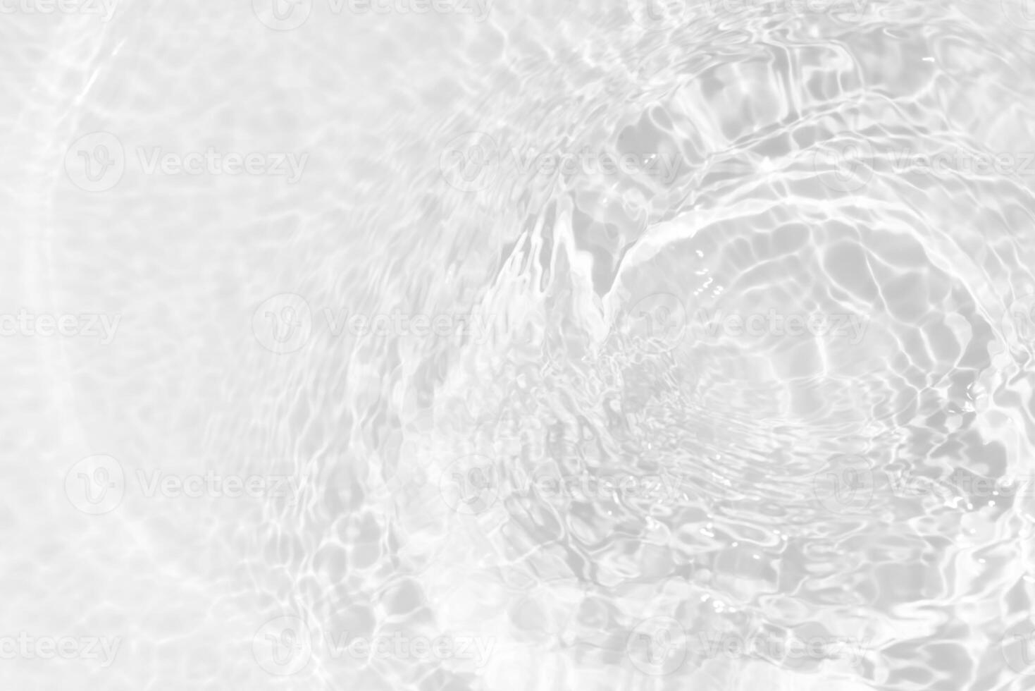 Blue water with ripples on the surface. Defocus blurred transparent blue colored clear calm water surface texture with splashes and bubbles. Water waves with shining pattern texture background. photo