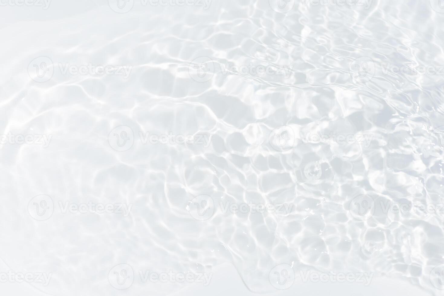Blue water with ripples on the surface. Defocus blurred transparent blue colored clear calm water surface texture with splashes and bubbles. Water waves with shining pattern texture background. photo