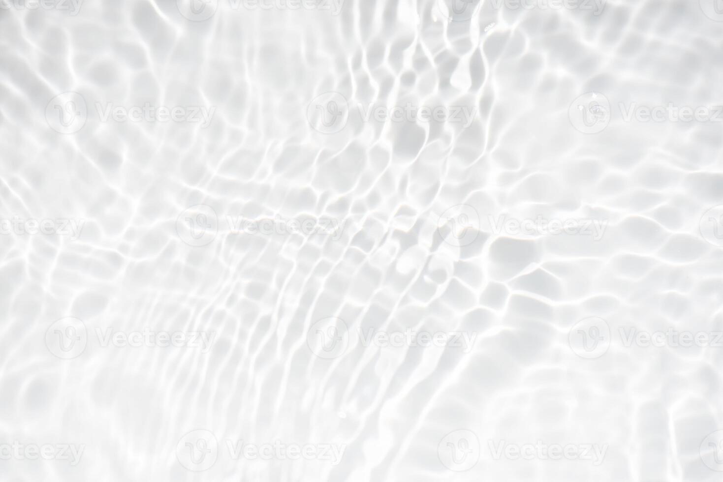 Bluewater waves on the surface ripples blurred. Defocus blurred transparent blue colored clear calm water surface texture with splash and bubbles. Water waves with shining pattern texture background. photo