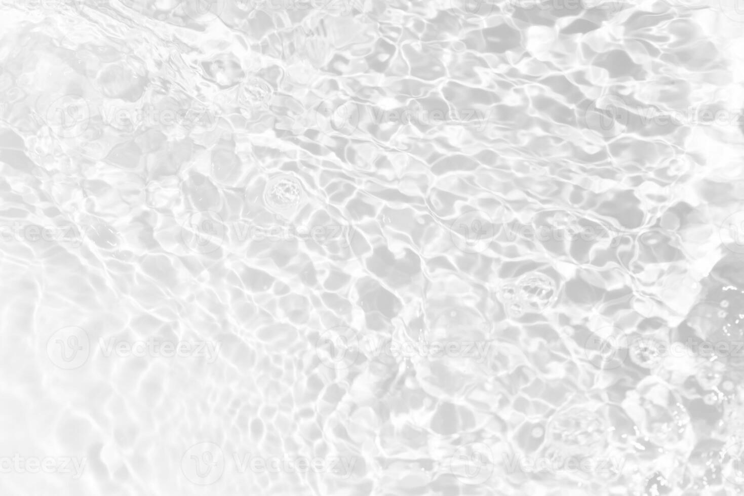 Bluewater waves on the surface ripples blurred. Defocus blurred transparent blue colored clear calm water surface texture with splash and bubbles. Water waves with shining pattern texture background. photo