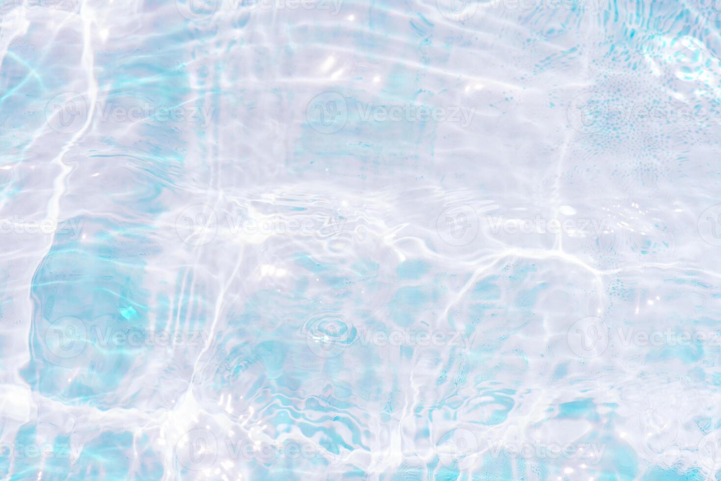 Bluewater waves on the surface ripples blurred. Defocus blurred transparent blue colored clear calm water surface texture with splash and bubbles. Water waves with shining pattern texture background. photo
