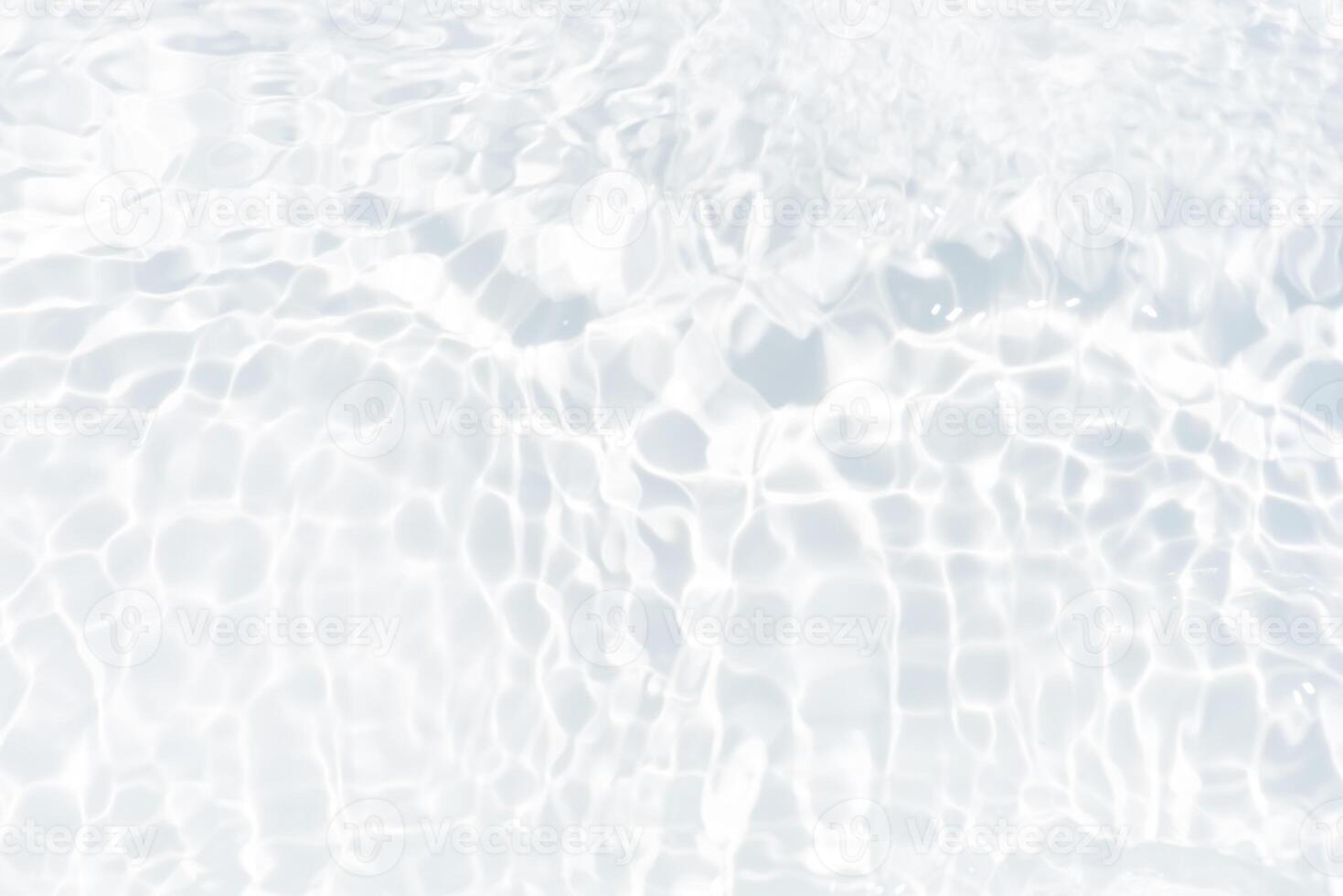 Blue water with ripples on the surface. Defocus blurred transparent blue colored clear calm water surface texture with splashes and bubbles. Water waves with shining pattern texture background. photo