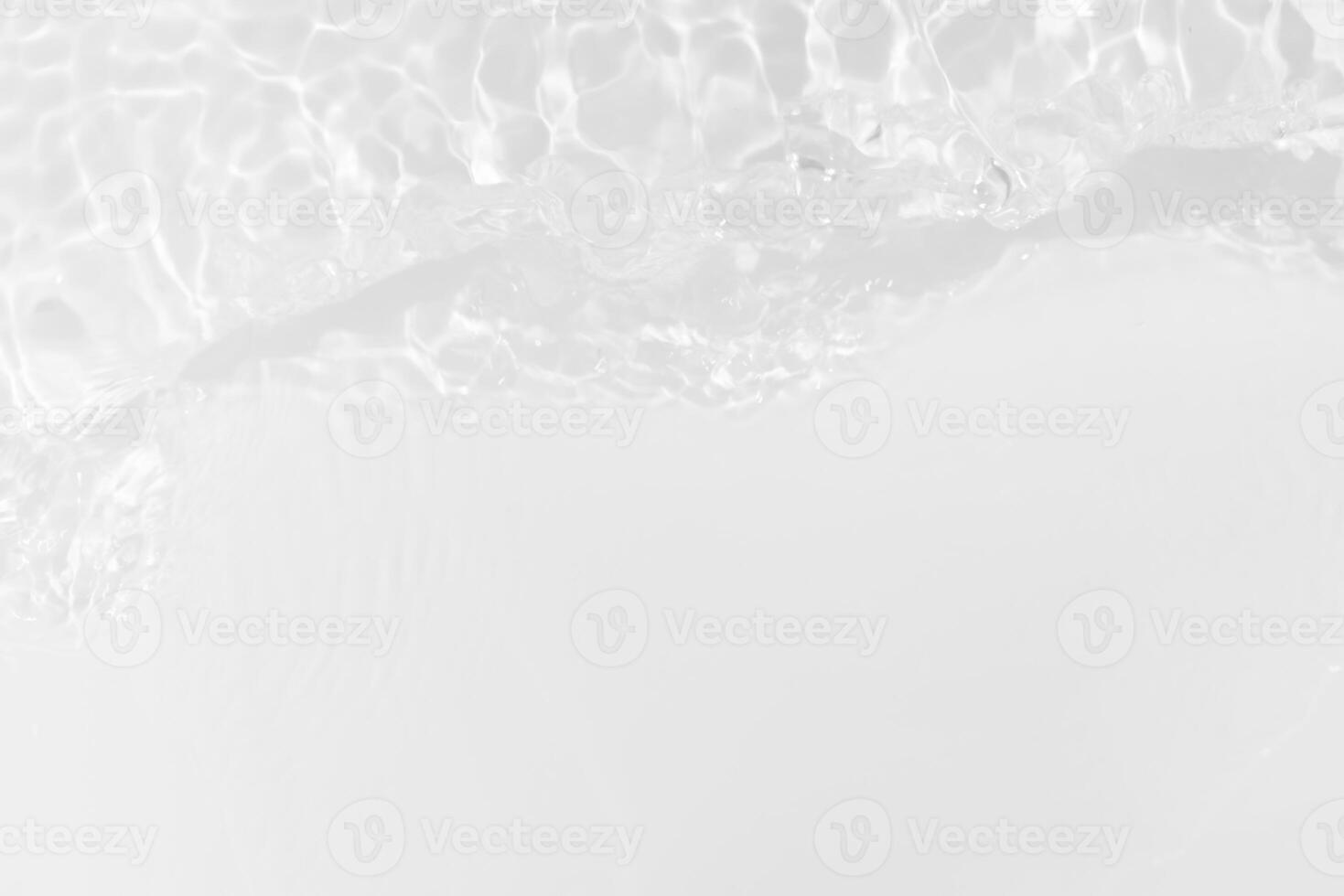 Bluewater waves on the surface ripples blurred. Defocus blurred transparent blue colored clear calm water surface texture with splash and bubbles. Water waves with shining pattern texture background. photo