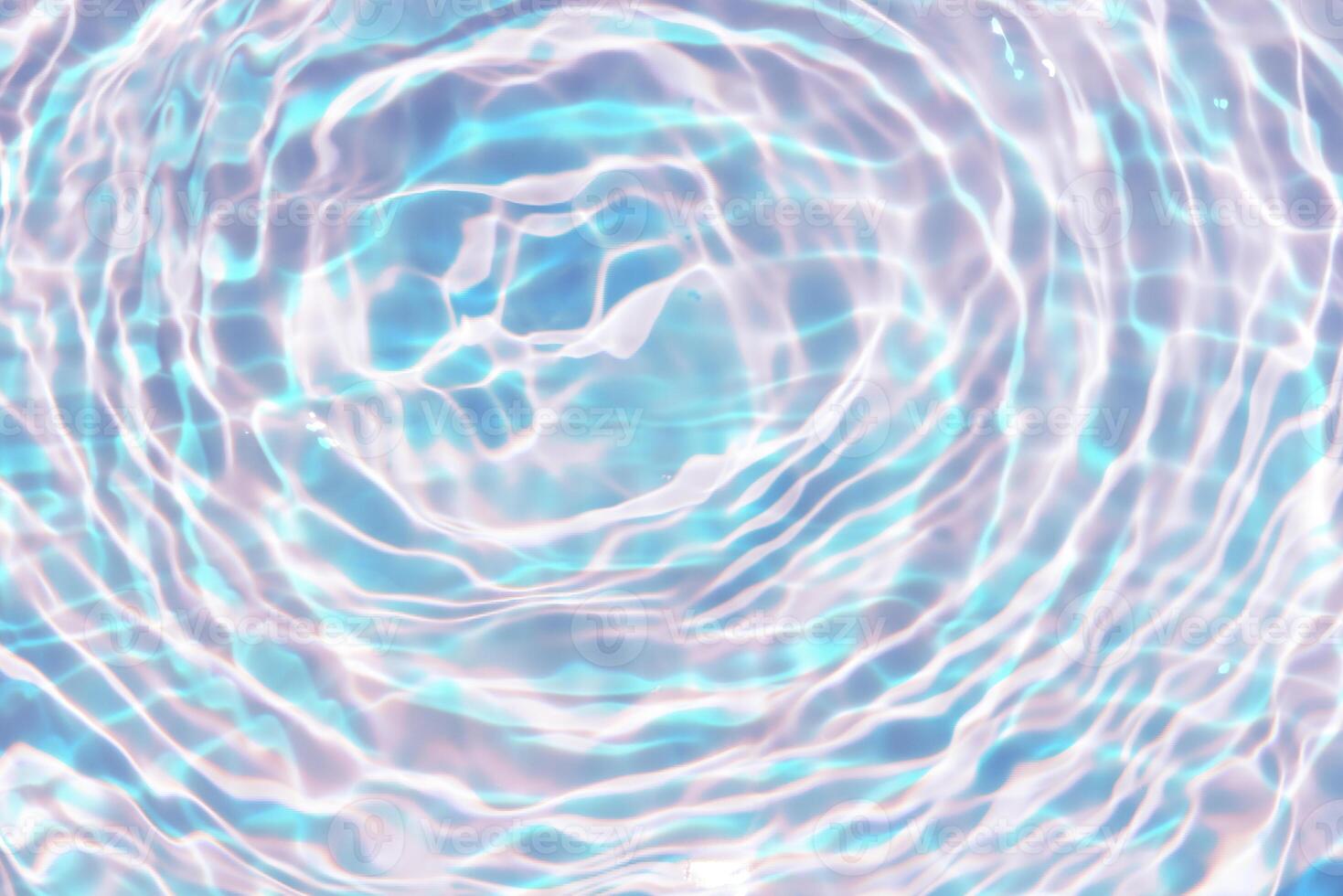 Bluewater waves on the surface ripples blurred. Defocus blurred transparent blue colored clear calm water surface texture with splash and bubbles. Water waves with shining pattern texture background. photo