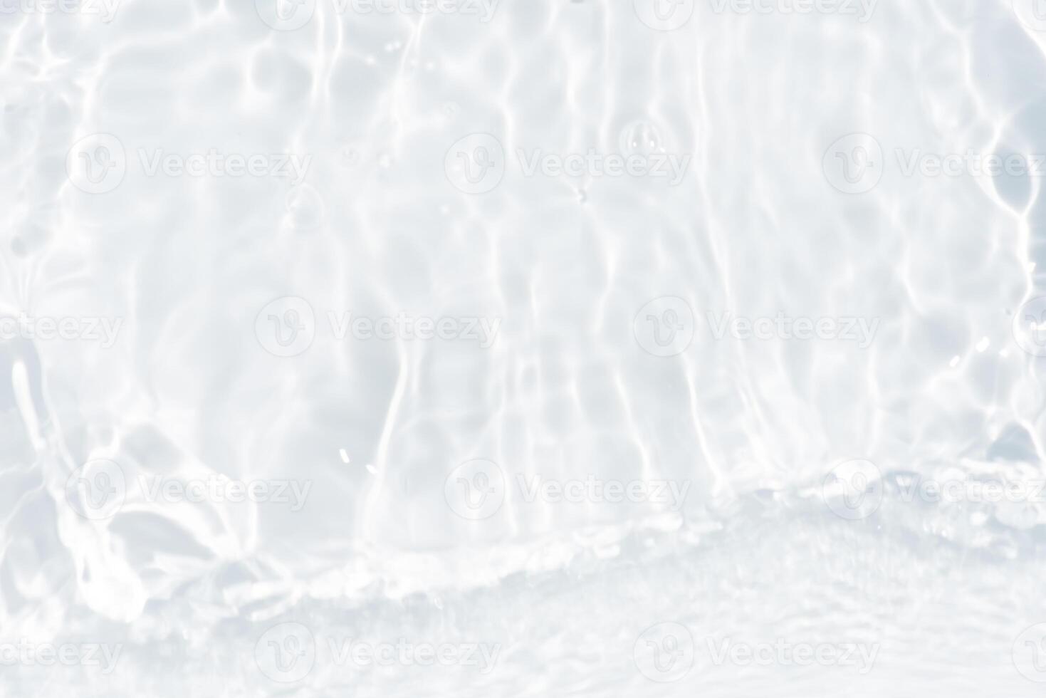 Blue water with ripples on the surface. Defocus blurred transparent blue colored clear calm water surface texture with splashes and bubbles. Water waves with shining pattern texture background. photo