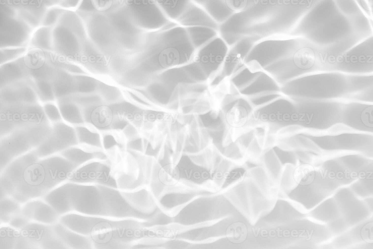 Bluewater waves on the surface ripples blurred. Defocus blurred transparent blue colored clear calm water surface texture with splash and bubbles. Water waves with shining pattern texture background. photo