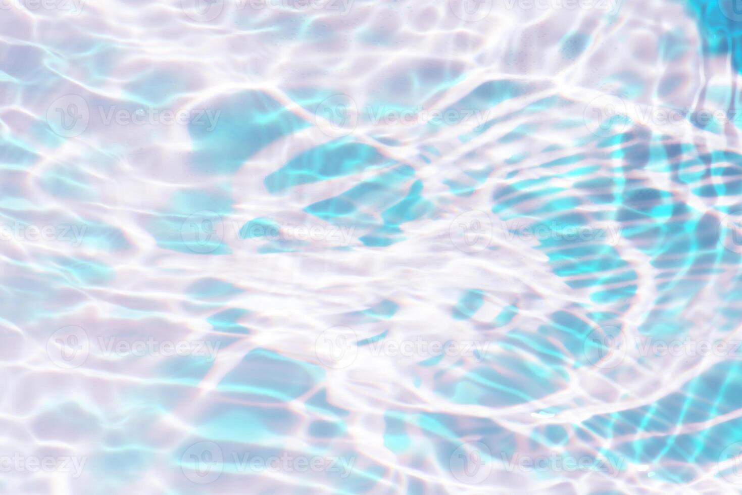 Bluewater waves on the surface ripples blurred. Defocus blurred transparent blue colored clear calm water surface texture with splash and bubbles. Water waves with shining pattern texture background. photo