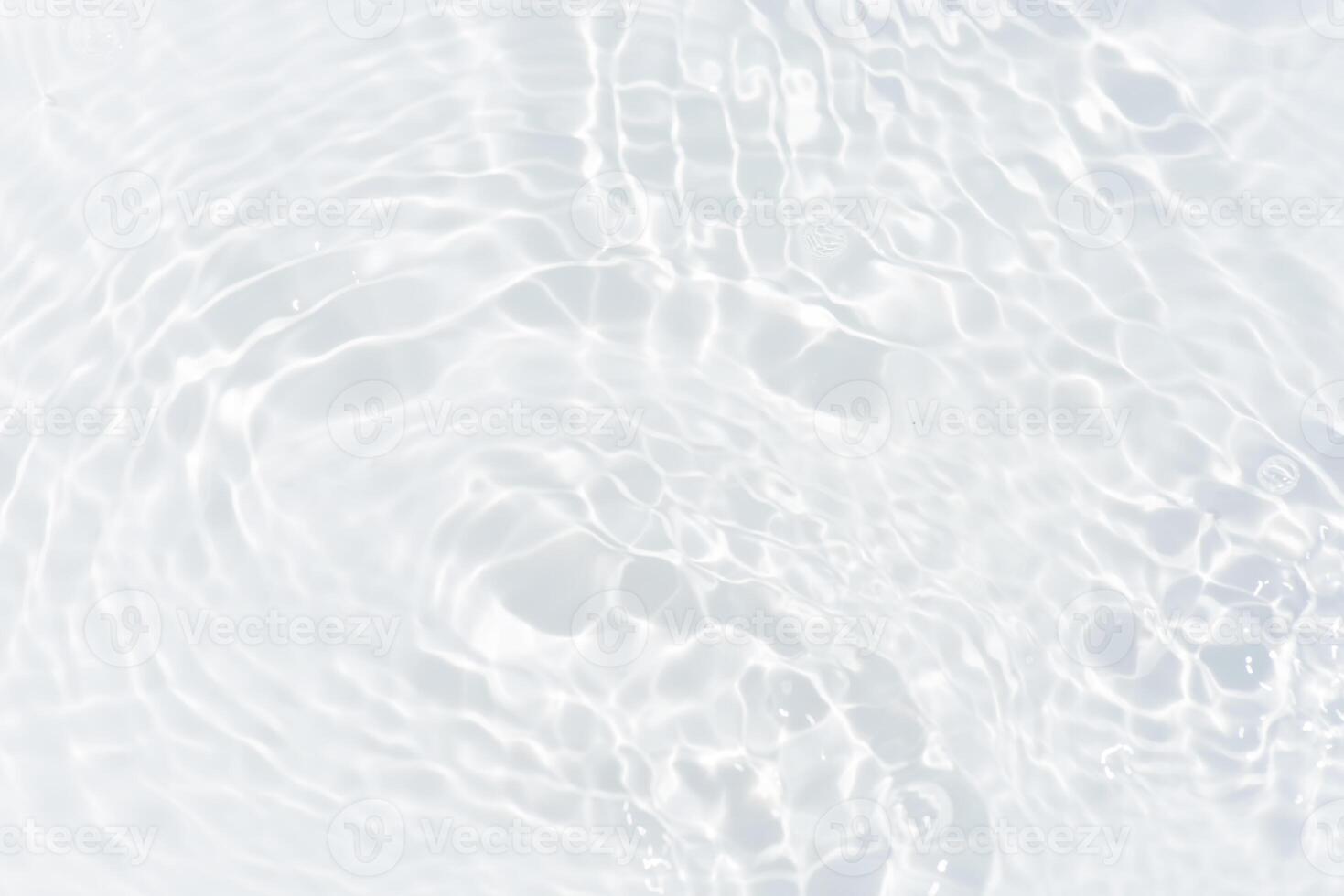 Blue water with ripples on the surface. Defocus blurred transparent blue colored clear calm water surface texture with splashes and bubbles. Water waves with shining pattern texture background. photo