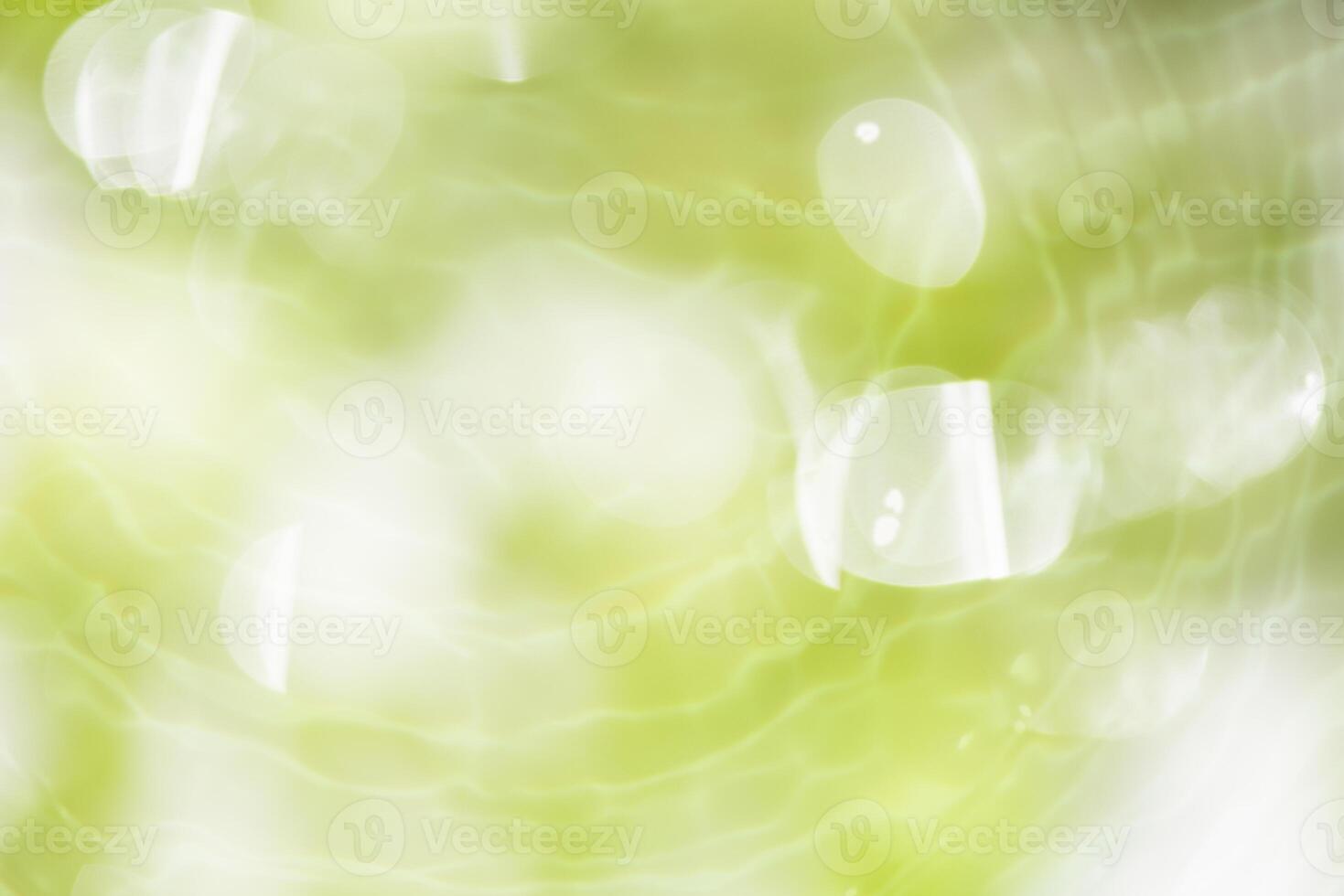 Bluewater waves on the surface ripples blurred. Defocus blurred transparent blue colored clear calm water surface texture with splash and bubbles. Water waves with shining pattern texture background. photo