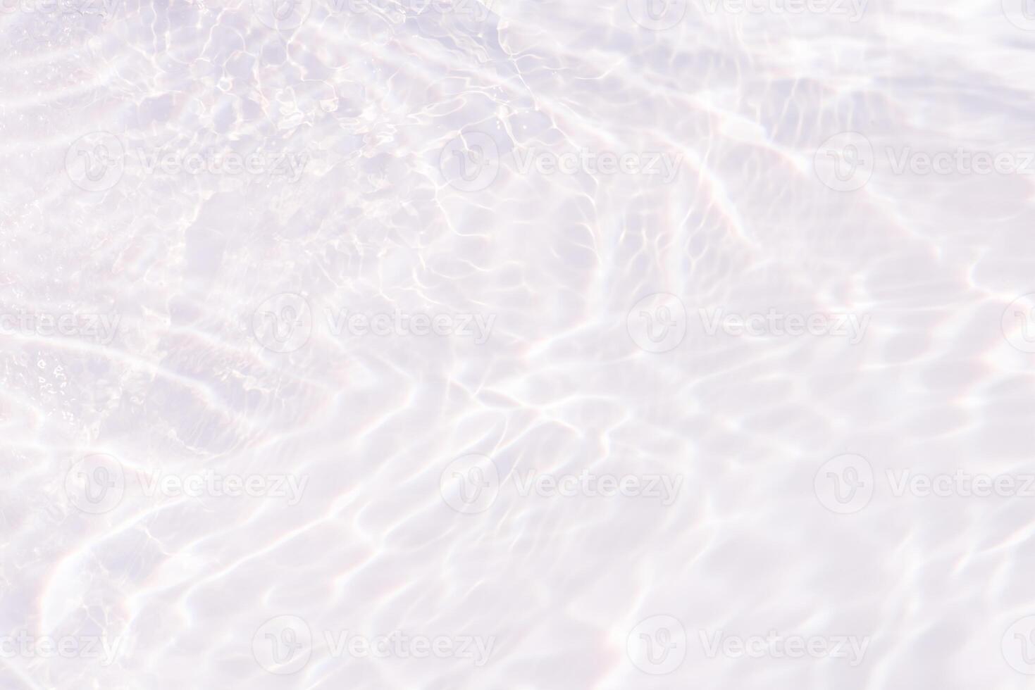 Bluewater waves on the surface ripples blurred. Defocus blurred transparent blue colored clear calm water surface texture with splash and bubbles. Water waves with shining pattern texture background. photo