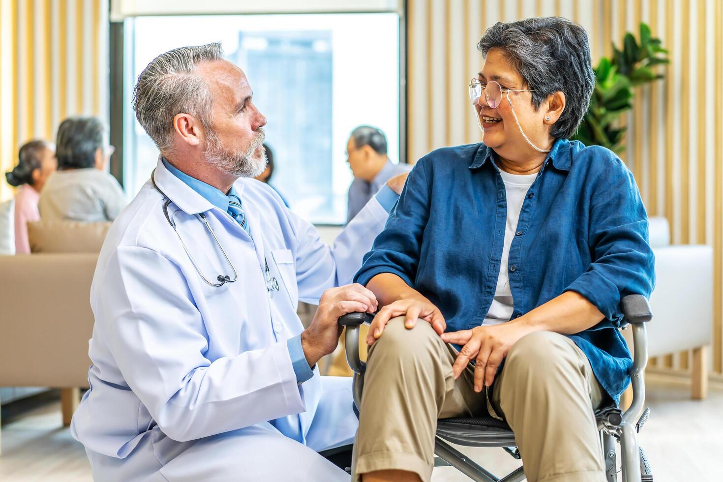 Orthopedist examines the knee of elderly patient to collect information for physical therapy treated. Doctor touch knee pain area of Old woman legs talking about knee pain symptom. photo