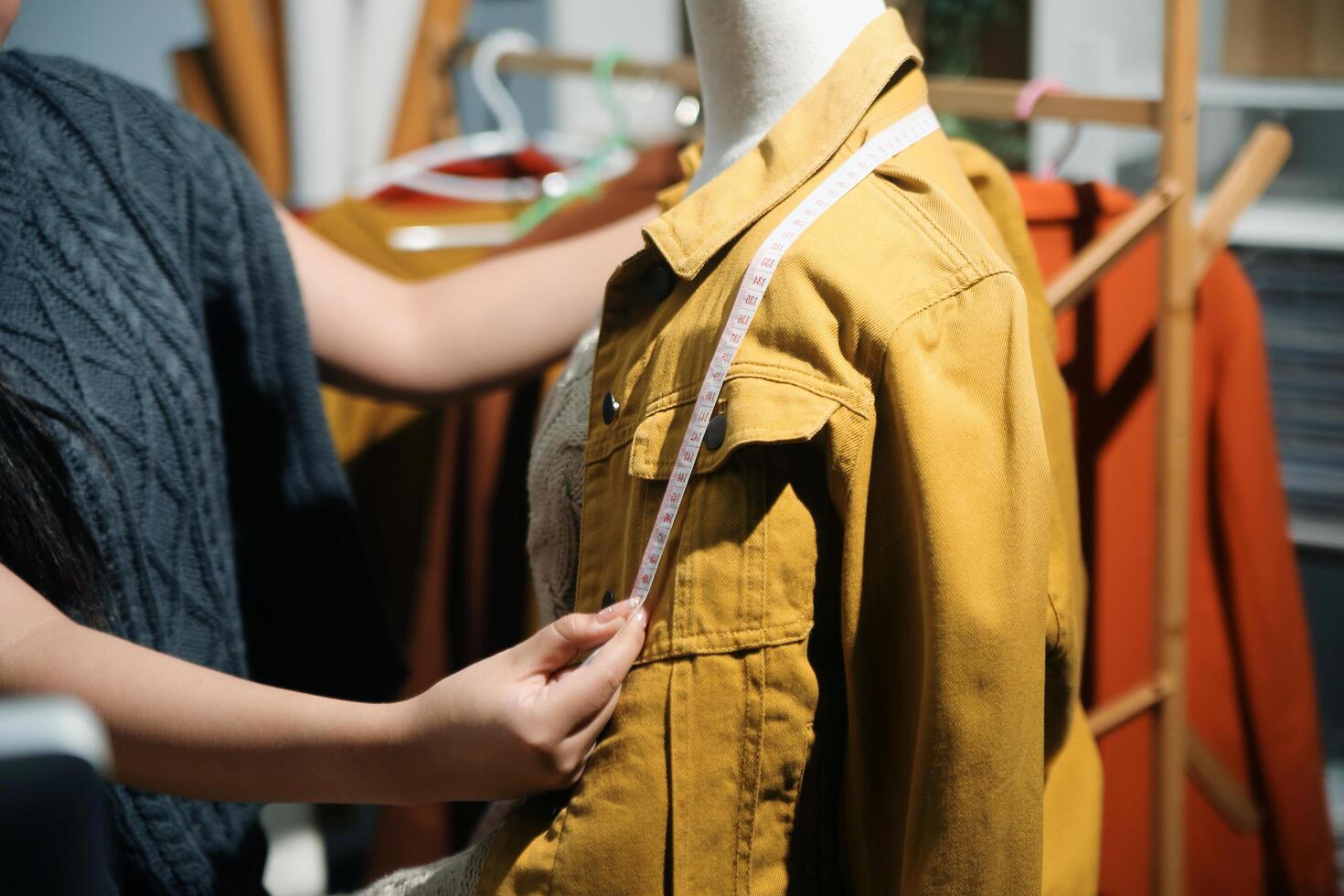 Fashion designers at work. beautiful young woman working in fashion design studio. photo