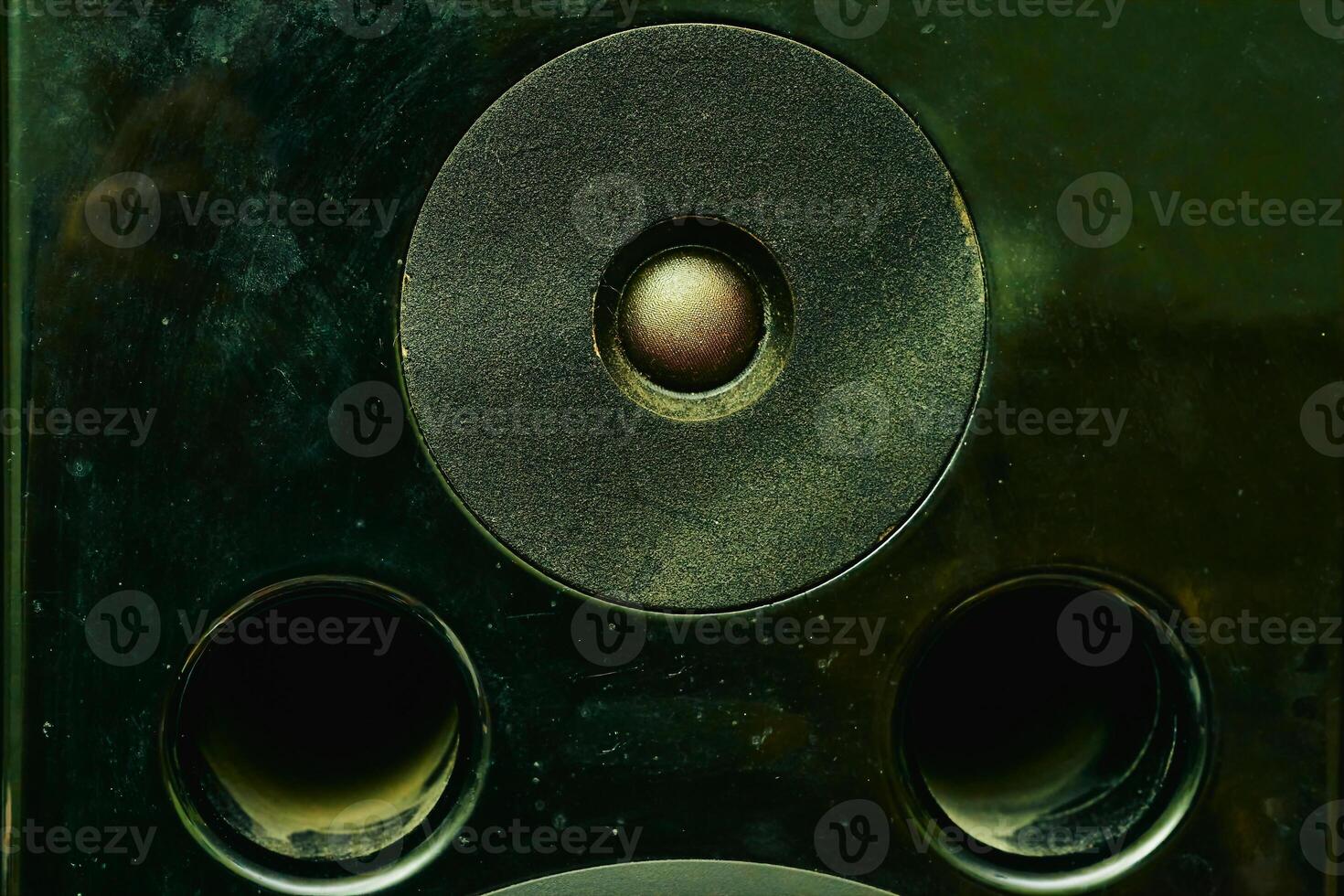 High frequency speaker tweeter in the column on dark photo