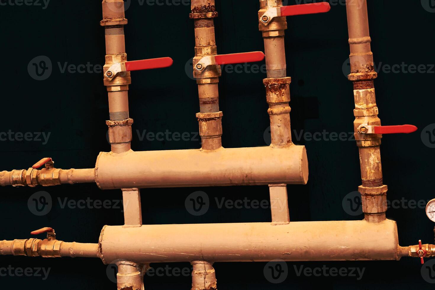 Pipes and water shutoff.Brown sewer water boiler system with pressure gauge photo