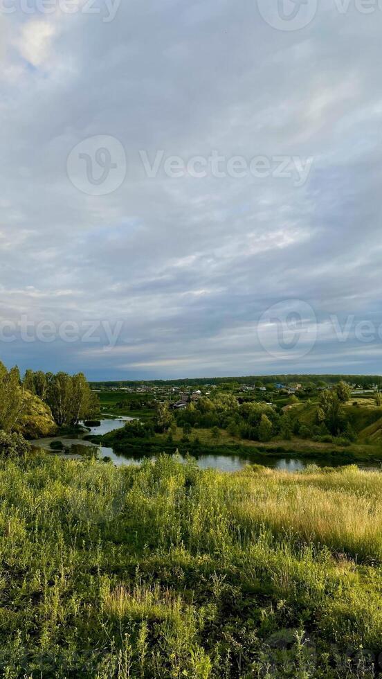 Perfect spring scene and morning meadow near the river with aloe tree on the shore. Location place river Europe. Photo wallpaper.
